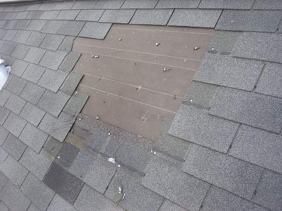 Wind damaged Md Roof