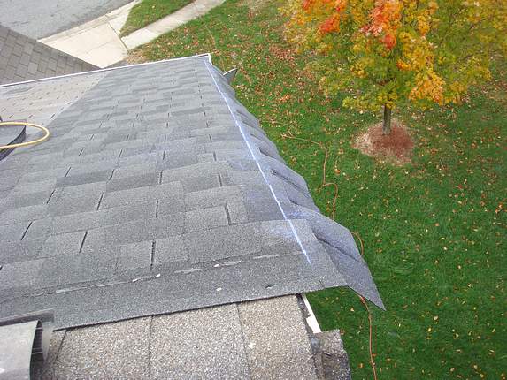 Cutting the Roofing with a Hook Blade